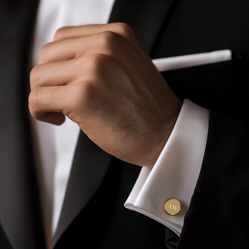 Personalised gold cufflink worn on groom’s wrist — timeless wedding accessory and meaningful keepsake