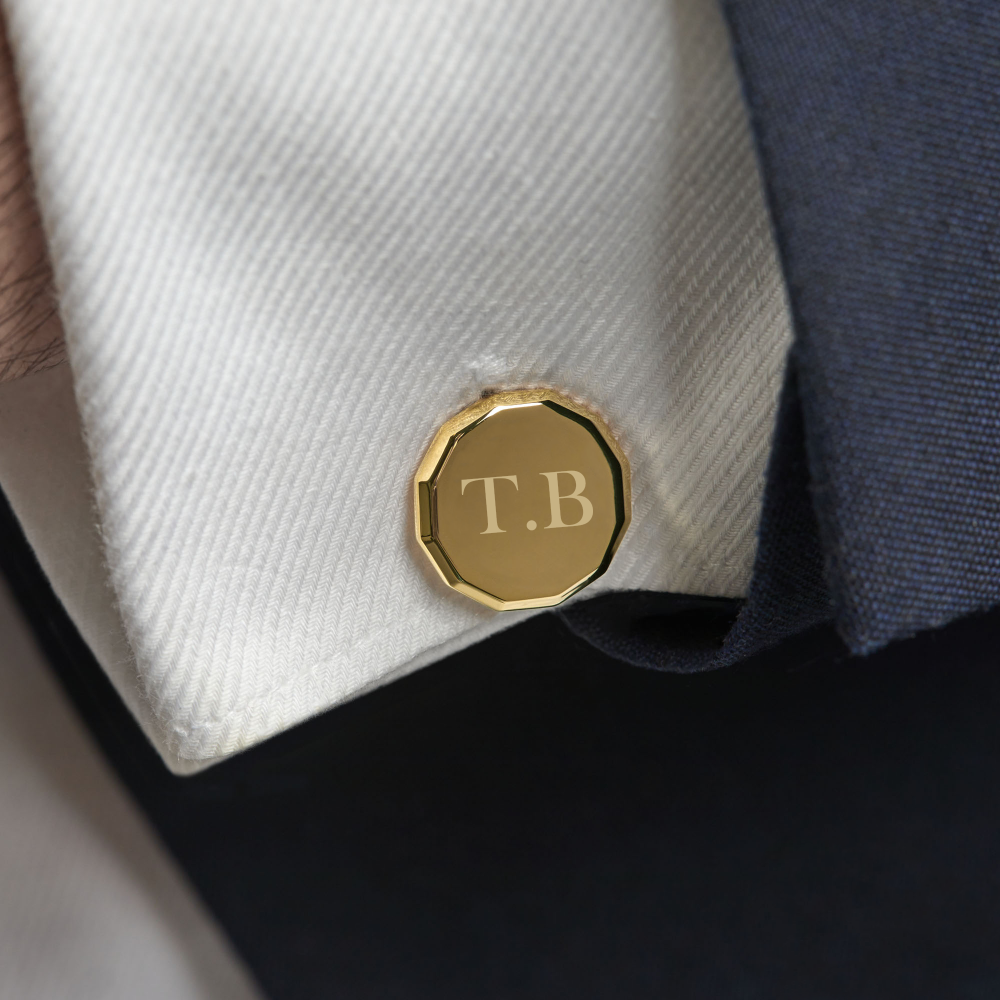 Islington gold cufflink worn by groom in wedding suit showing polished twelve-sided profile