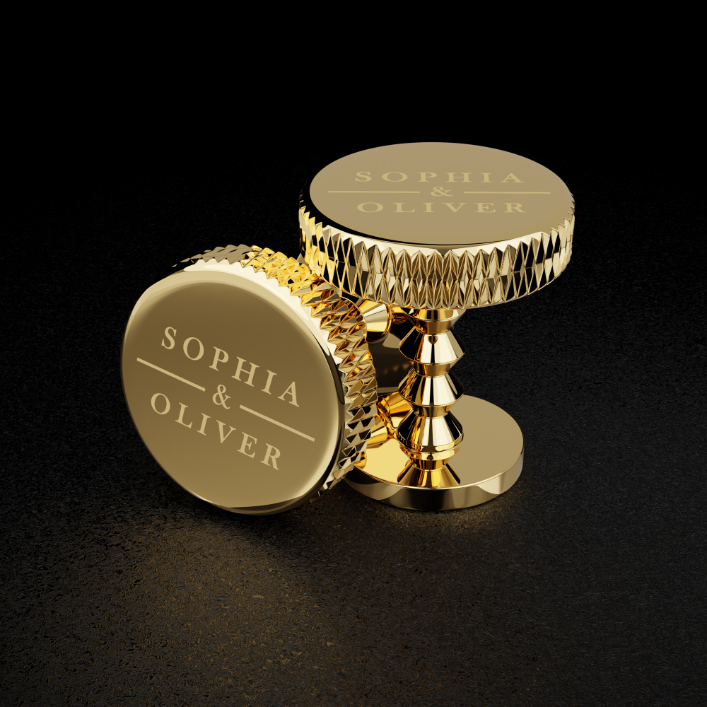 custom-engraving-close-up.png Personalised gold cufflinks engraved with names Sophia and Oliver shown in detail